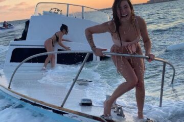 Woman in pink bikini on sinking boat - original generation